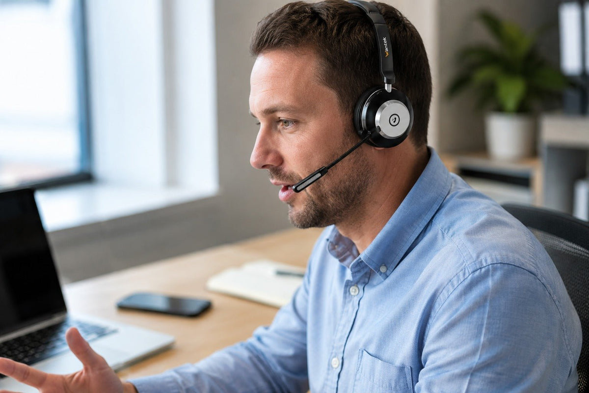 Wantek WK881BT single-ear Bluetooth headset with boom mic used for an office laptop call