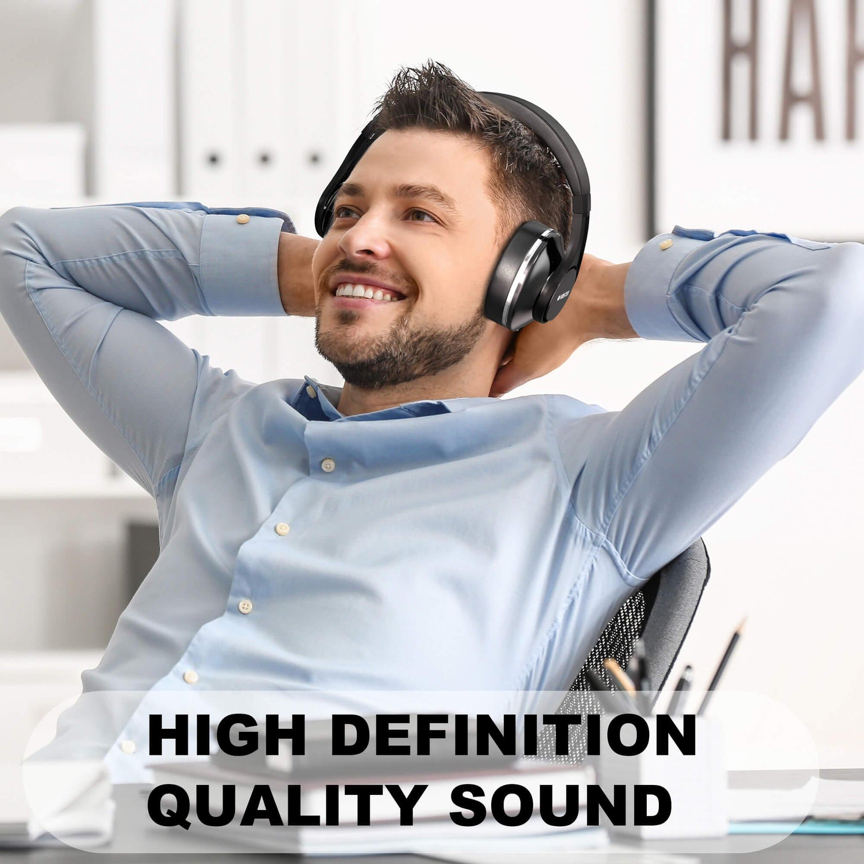 Man wearing Voistek TH20S black wireless headphones for music listening