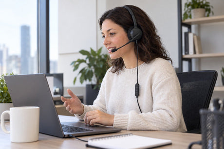 Wantek H882 wired PC headset with boom mic and inline controls during a laptop call