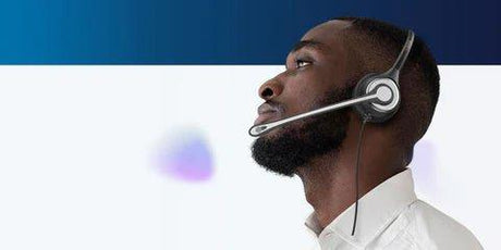 Man wearing a lightweight wired headset with microphone for business use, shown in a side profile against a blue and white background