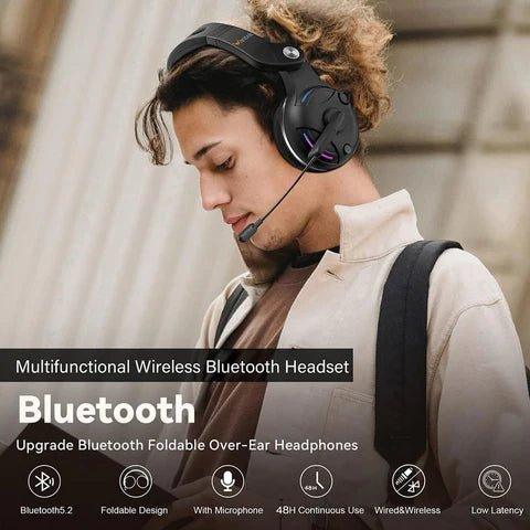 Person wearing multifunctional wireless Bluetooth foldable over-ear headset with microphone in urban setting