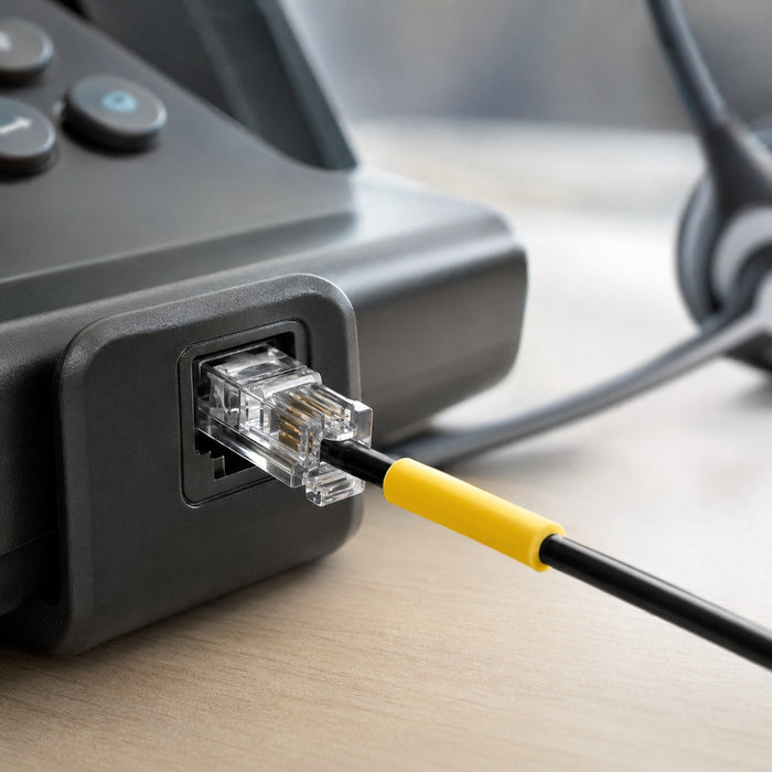 RJ4-wired headset connected directly to an office telephone
